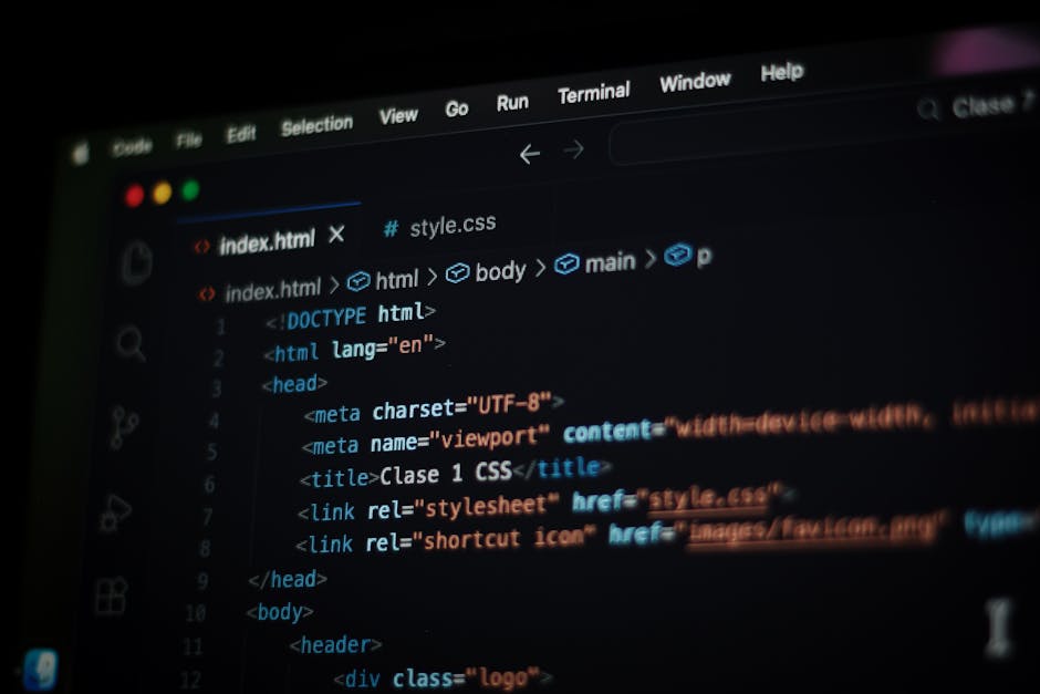 A close-up of a computer screen displaying HTML code, including tags such as <!DOCTYPE html>, <html>, <head>, <title>Clase 1 CSS</title>, and <link rel='stylesheet'>, suggesting web development work. 